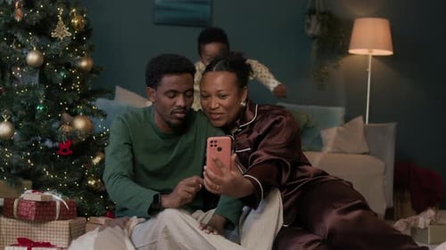 Family Taking Christmas Selfie at Home