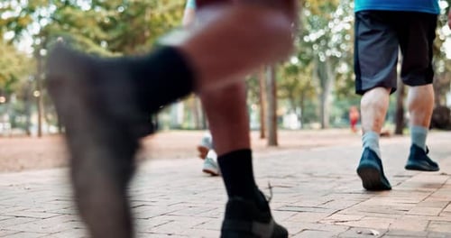 People, sneakers and running for race, fitness and workout in park for urban marathon club