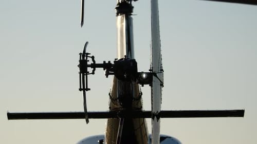 Helicopter Tail Rotor Close Up Spinning Against Sky