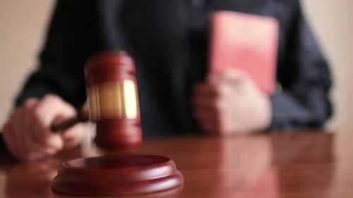 Close Up of Gavel Being Tapped in Court