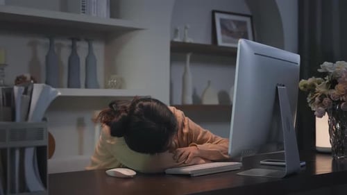 Busy stressed businesswoman working overtime, falls asleep at home late at night due to overwork, mu