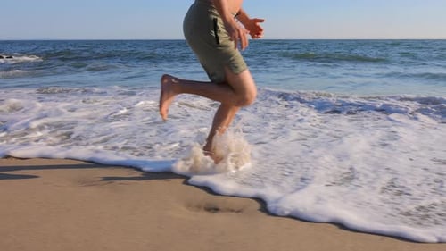 Athletic Man Exercising At The Beach