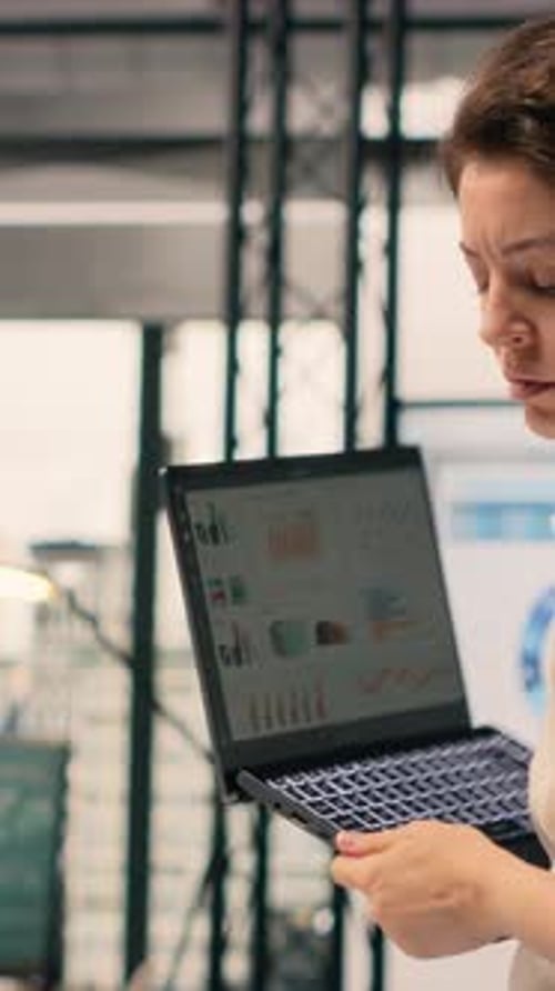 Vertical Video Woman Business Worker Focused on Charts Analytics Dashboard