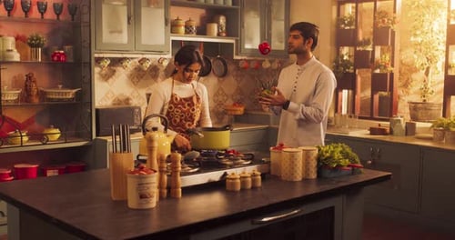 Beautiful Indian Couple Preparing Food in Kitchen: Girl Experimenting with Flavors, Discovering Ne