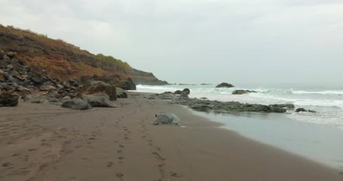 Sea Waves On The Rocky Volcanic Beach Of The Atlantic Ocean In Tenerife, Canary Islands, Spain. Stat
