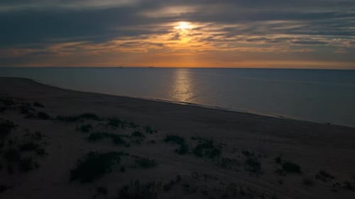 Aerial View Sea Coastline at Orange Sunrise. Drone Calm Waves Splashing