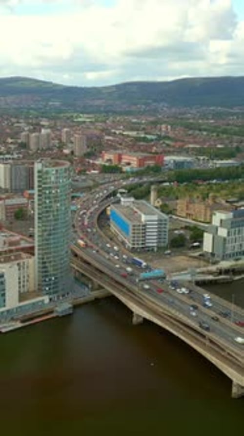 Wide reversing social ratio aerial video GV of Belfast City Centre