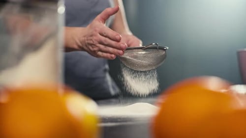 Close Up Shot of Sifting White Flour