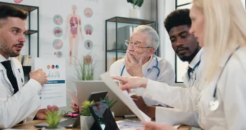 Medical Team Brainstorming in Modern Office Setting