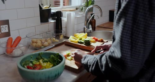 Preparing Vegetables for Salad at Kitchen Counter