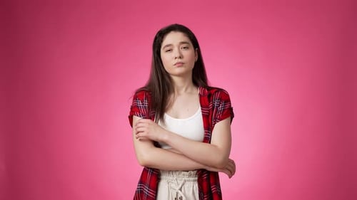 Woman Thinking and Having an Idea on Pink Background