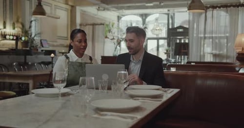 Small Business Owner talking with Financial Advisor Investor
