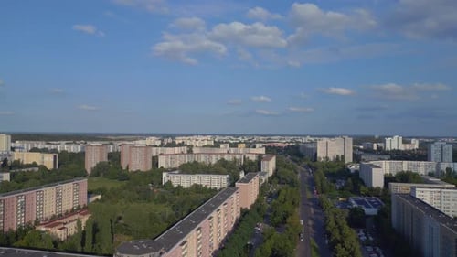 cityscape sports field amidst high rise buildings. Smooth aerial top view flight
rotation to left d