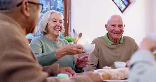 Senior Citizens Toasting With Tea