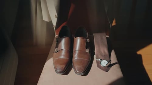 Men's wedding accessories: Brown leather shoes, tie, watch