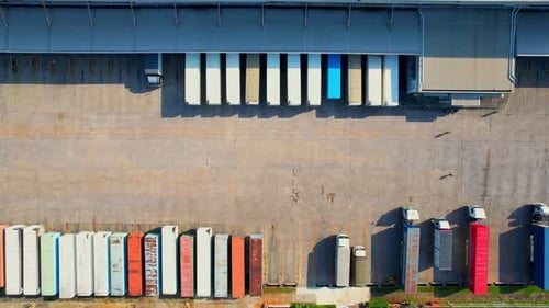 Many of Semi-trailer trucks stand at the distribution center