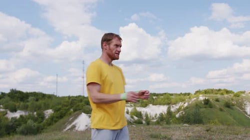 Man Exercising Outdoors with Resistance Band