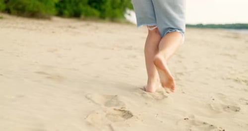 Woman Feet Running Barefoot on Sandy Beach of Sea