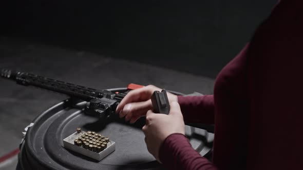 Hands of Woman Loading Rifle Magazine with Bullets in Range, People ...