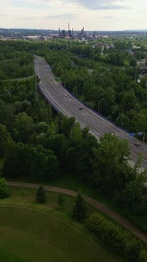 Ostrava city bypass in green landscape with industrial zone horizon
