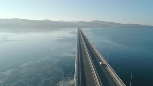 Aerial Drone View of Lowwater Bridge Across the Bay with Moving Car Active Movement of Transport