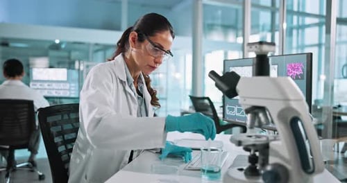 Female Scientist Working in Modern Research Laboratory