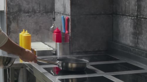 Chef Frying Ingredients Cooking at Restaurant Kitchen