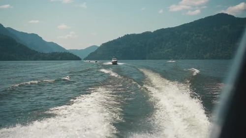 Foamy Trail on Water and Sailing Tourist Boat in Sunny Sea
