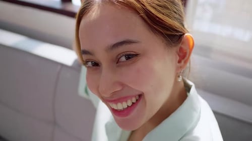 Attractive Young Woman Smiling Cheerfully Indoors