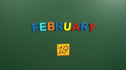 Hand sticking a sticker 19 February calendar day on school board. 19 date of February. Nineteenth