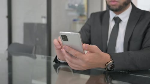 Close up of Businessman Using Phone, Typing