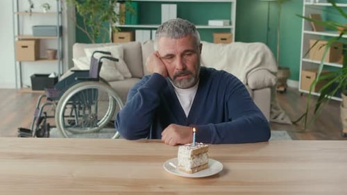 Lonely Man with Birthday Cake at Table