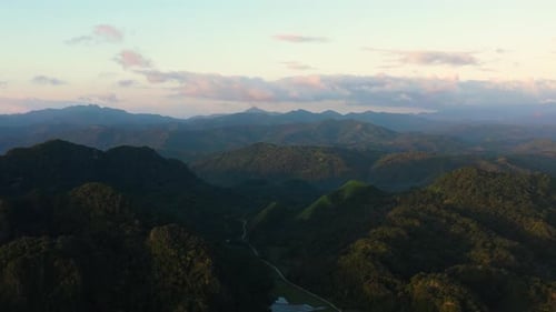 Aerial View of Lush Green Mountains at Sunrise
