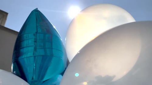 Balloons Reflect Sunlight on a Beautiful Day