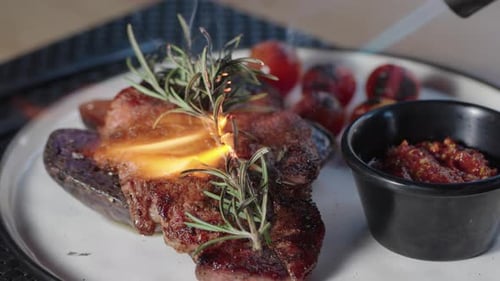 Seared Steak with Rosemary Garnished by Blow Torch