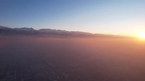 Epic Gray Smog is Visible at Sunset Over the City