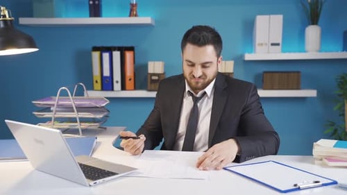 Man Working at Desk on Computer in Office