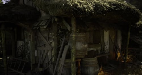 Old Rustic Wooden Cabin with Thatched Roof and Barrels in a Forest