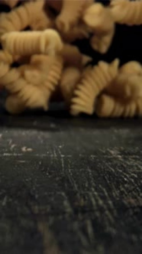 Dry Pasta Falls on the Table Filmed on a Highspeed Camera at 1000 Fps