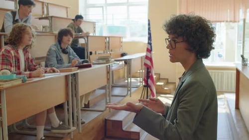 Teacher Lecturing to Students in a Classroom