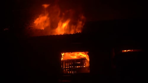 Heavy fire in house at night