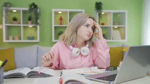 University student girl with a problem is bored and pensive.