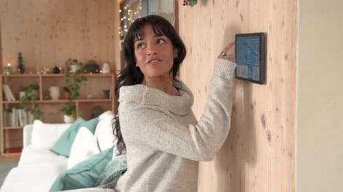 Woman Controls Smart Home with Digital Tablet