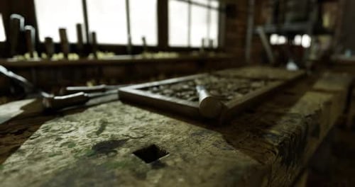 Crafting Tools and Wooden Bench in a Vintage Workshop Filled with Sunlight