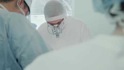 Surgeons Performing Operation in Hospital Operating Room