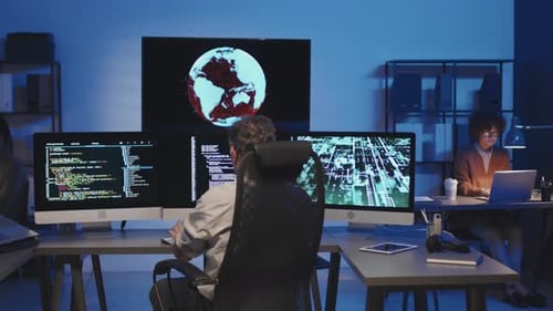 Group of Programmers Working in IT Office