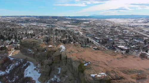 Aerial View of Scenic Town and Rocky Cliffside