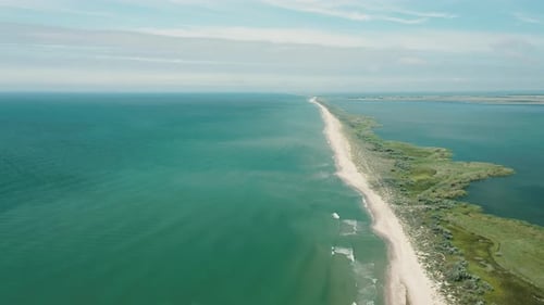 Aerial View of Waves on a Gritty Ocean Beach