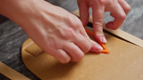 Hands Cut Cookie Dough With Triangular Cutter