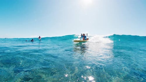 Woman Surfer Riding Big Waves in Tropical Ocean